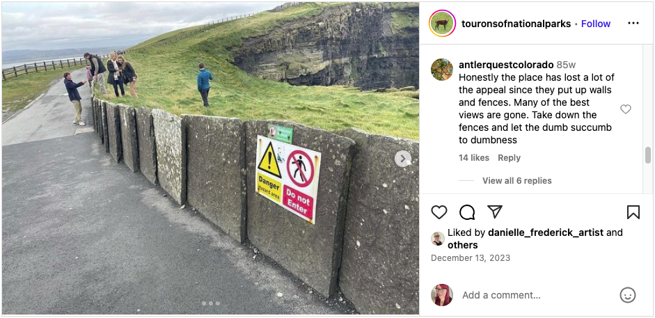 a concrete wall at the Cliffs of Moher with a sign that reads: DANGER Do Not Enter with a group of entitled dumdums who have entered.