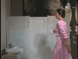 lynda carter as wonder woman in the 1970s tv series, twirling from secret identity into wonder woman.